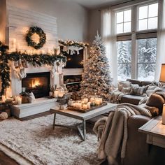 a living room filled with furniture and a christmas tree next to a fire place in front of a window