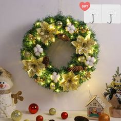 a christmas wreath on the wall with decorations around it