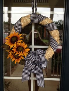 a sunflower is hanging on the front door