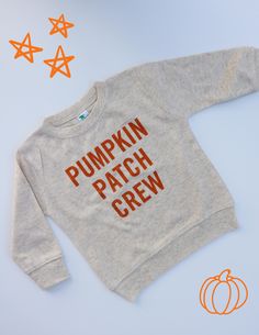 *design is printed with ink on-to shirts* please note that the pullovers are lightweight - not lined. perfect for layering for fall :)  Gear up for the coziest season with our adorable "Pumpkin Patch Crew" collection, perfect for the entire family! Whether you're heading out to pick the perfect pumpkin or simply enjoying a crisp fall day, our neutral-colored shirts, onesies, and pullovers are designed to keep your little ones stylish and comfortable. Crafted from soft, high-quality fabric, these Screen Print Crew Top For Fall, Fall Crew Neck Screen Print Tops, Fall Crew Tops With Letter Print, Unisex Graphic Tee For Fall, Cute Cotton Sweater With Graphic Print, Cotton Sweatshirt With Screen Print For Fall, Cute Long Sleeve Custom Print T-shirt, Cotton Crew Sweater With Graphic Print, Unisex Cotton Sweatshirt For Fall