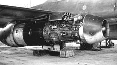 an old jet engine sitting on top of a tarmac