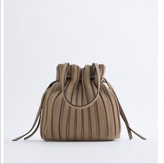 Zara Brown Pleated Bucket Bag Nwt Beige Crossbody Evening Bag For Shopping, Luxury Beige Pouch Hobo Bag, Chic Khaki Rectangular Bucket Bag, Chic Rectangular Khaki Bucket Bag, Beige Shoulder Bag Pouch For Shopping, Beige Designer Satchel Shoulder Bag With Dust Bag, Zara Pouch Bag With Adjustable Strap, Beige Tote Bag For Evening, Office Clutch With Detachable Strap In Beige