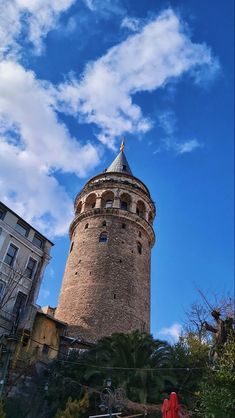 a tall tower with a clock on it's side