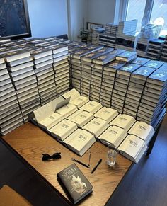 there are many books stacked on top of each other in this room, and one is empty