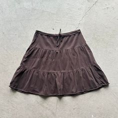 *Size unknown, would say it's a woman's S, refer to measurements *In great condition *Tie front *Cute ruffle detailing *Great color, can go with any outfit *Soft fabric *Lightweight *Message us any questions Waist: 15 = 30 in Length: 19 in Y2k Tiered Ruffled Mini Skirt, Y2k Tiered Skirt Bottoms With Ruffles, Y2k Ruffled Tiered Skirt, Y2k Tiered Skirt With Ruffles, Y2k Tiered Ruffle Skirt Bottoms, Y2k Mini Skirt With Ruffles, Casual Cotton Mini Skirt With Ruffle Hem, Casual Cotton Ruffled Skirt, Brown Tiered Ruffle Skirt