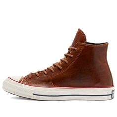 If you're looking for a classic sneaker with a premium twist, look no further than the Converse Chuck 70 High Color Leather 'Clove Brown'. This high-top sneaker features a full-grain leather upper with tonal stitching and waxed laces for a sophisticated look. The debossed All Star patch on the medial ankle adds a touch of retro style, while the glossy off-white rubber midsole provides cushioned comfort. Underfoot, the standard diamond-pattern rubber outsole delivers grippy traction. (SNKR/Unisex) Classic High-top Lace-up Sneakers For Streetwear, Classic Lace-up High-top Sneakers For Streetwear, Retro High-top Skate Shoes With Boost Midsole, Classic High-top Sneakers For Streetwear, Vintage Lace-up Sneakers With Rubber Toe Cap, Retro High-top Sneakers With Boost Midsole, Brown High-top Sneakers With Boost Midsole, Brown High-top Sneakers With Gum Sole, Brown High-top Skate Shoes With Rubber Sole