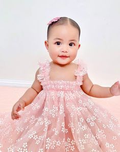 Gorgeous tulle daisy print dress that is lined with a light pink cotton perfect to wear on your little baby/kids birthday/ special occasion and pairs perfectly with our rainbow fairy wings. available baby pink, white & lilac in 6 sizes and true to size Size 6-12 months | length 47cm, chest 47cm Size 1 | length 50cm, chest 50cmSize 2 | length 53cm, chest 53cm Size 3 | length 57cm, chest 56cm Size 4 years | length 60cm, chest 59cm Size 5-6 years | length 64cm, chest 62cm Please handwash only Daisy First Birthday Outfit, Spring Tulle Princess Dress For First Birthday, Pink Daisy First Birthday Theme, Daisy Birthday Dress, Baby Pink Romper, Tulle Outfit, Pink Flower Dress Kids, Daisy Print Dress, White Tulle Dress