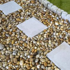 some rocks and gravel in a garden area