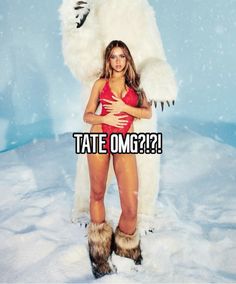 a woman in a red bathing suit standing next to a giant white bear with the caption tate omg?