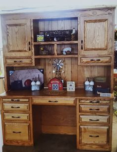 a wooden desk topped with lots of drawers