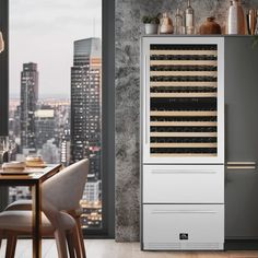 a white wine cooler sitting in front of a window