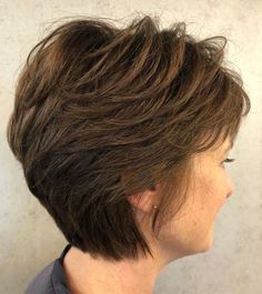 the back of a woman's head with short brown hair