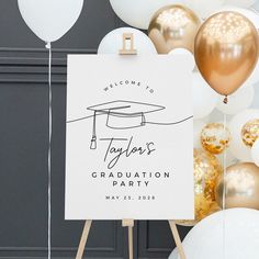 a graduation party welcome sign with balloons in the background