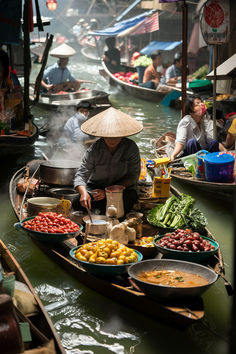 a woman sitting on top of a boat filled with lots of food next to other boats