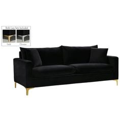 a black couch with gold legs and two pillows on top of the backrests