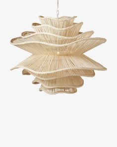 a light that is made out of bamboo sticks and hanging from a ceiling fixture in the shape of a flower