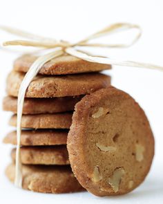 a stack of cookies tied with a white ribbon