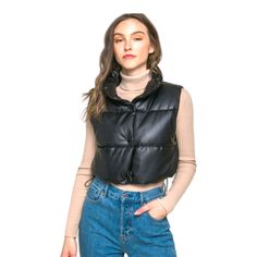 Add A Touch Of Edgy Style To Your Casual Outfits With Our Pu Faux Leather Puffer Vest. This Trendy Puffer Vest Is Perfect For Layering Over Your Favorite Tops. This Is A Versatile And Must-Have Addition To Your Casual Wardrobe, Perfect For Staying Warm And Fashionable During Cooler Days. Model Spec: Model Is 5' 7" Wearing A Size Small. Made In Vietnam Style:Casual Print Pattern:Pu Faux Silhouette:Puffer Vest Fit:Regular Embellishment:Button Neck Line:Collar Sleeve:Sleeveless Length:Cropped Closu Winter Faux Leather Outerwear With Button Closure, Versatile Winter Outerwear With Buttons, Trendy Faux Leather Outerwear With Snap Buttons, Versatile Winter Outerwear With Button Closure, Black Faux Leather Outerwear With Button Closure, Casual Faux Leather Outerwear With Button Closure, Black Faux Leather Outerwear, Casual Faux Leather Outerwear With Snap Buttons, Trendy Black Outerwear For Everyday