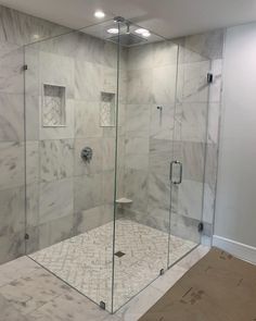 a walk in shower sitting inside of a bathroom