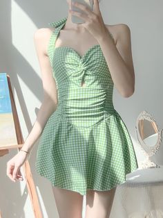 Elevate your poolside look with our this sweet swim dress. This sexy swimsuit dress, with its trendy plaid pattern, is a showstopper. The backless design and frill detailing make a flirty statement, while the ruffle hem adds a feminine touch. The spaghetti strap neckline and lace-up tie back give this high waist piece a contemporary edge. Sleeveless and short in length, it's perfect for soaking up the sun. The flounce hem completes this gorgeous dress, ensuring you'll be the hottest babe at any summer gathering. You definitely need this knockout number in your swimwear collection. Style: SexyPattern Type: PlaidDetails: Backless, Frill, Ruffle Hem, lace up, Tie BackNeckline: Spaghetti StrapType: CamiSleeve Length: SleevelessWaist Line: High WaistHem Shaped: FlounceLength: Short Korean One Piece, Soft Girl Aesthetic, Women Skirt, Green Swimsuit, Swimsuit Women, Hot Spring, Beach Swimwear, Swimsuit Dress, Womens Bathing Suits