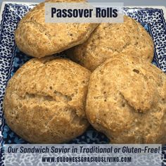 four biscuits on a blue and white plate with the words passover rolls