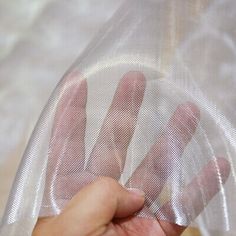 a person holding a plastic bag with their hand in it