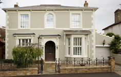 a large house with white trim and windows