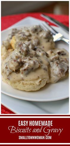 some biscuits and gravy on a white plate with a red table cloth in the background