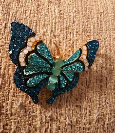 Beautiful aqua blue and green rhinestone 🦋 brooch. Beautiful as a gift for any occasion. Quick Shipping. Wedding Brooches, Butterfly Rhinestone, Butterfly Pin, Wedding Brooch, Bead Stitching, Butterfly Brooch, Rhinestone Jewelry, Rhinestone Brooches, Blue And Green