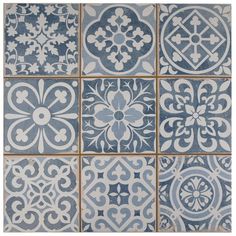 blue and white tiles with different designs on them