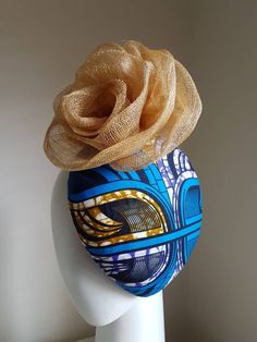 "This beautiful fascinator is part of our African \"Wakanda\" Inspired collection using a fusion of Ankara Fabric and traditional millinery materials - in this instance  -sinamay. I can also make this fascinator using your own ankara fabric to coordinate with your outfit for an extra fee of £5. The hat can be dispatched in 3-5 working days. Thank you for looking :)" Traditional Headband Fascinator For Party, Traditional Adjustable Fascinator For Parties, Gold Headband Style Headwrap For Wedding, Gold Headband-style Headwrap For Weddings, Blue Headband With Handmade Flowers, Multicolor Headband Fascinator For Weddings, Multicolor Wedding Headband Fascinator, Blue Handmade Flowers Headband, Multicolor Wedding Fascinator Headband