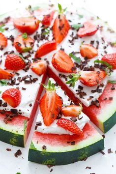 a watermelon slice with strawberries and chocolate shavings on the top