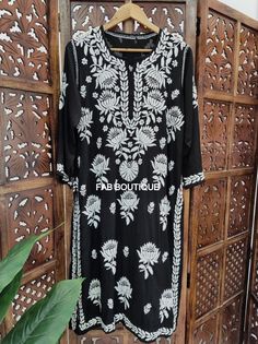 ▪ Kurti Fabric: Modal ▪ Kurti Length: 44-46 Inches ▪ Sleeves: 3/4 Sleeves ▪ Style: Straight Kurti ▪ Occasions: Party Wear, Office Wear, Festive Wear ▪ Garment Care: Hand Wash Only ▪ Price Includes: 1x Kurti Fitted Floral Embroidered Sharara For Eid, Designer Summer Kurta With Cutdana, Summer Designer Wear Kurta With Cutdana, Designer Cutdana Kurta For Summer, Fitted Cutdana Sharara For Summer, Fitted Black Churidar With Cutdana, Traditional Long Embroidered Churidar, Fitted Chanderi Kurta With Floral Embroidery, Embroidered Fitted Salwar Kameez For Eid