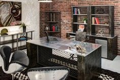 an office with brick walls and metal desk, chairs, bookshelves and shelves