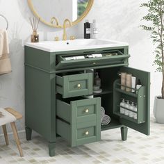 a bathroom vanity with drawers and a mirror