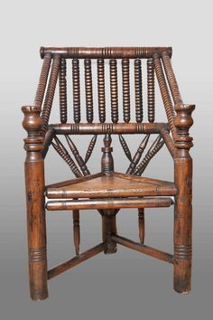 an old wooden chair with wickers on the back