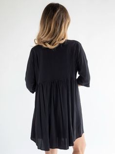 It's slouchy & easy to wear and the deep V-neckline is so fun! Chic Flowy V-neck Mini Dress, Flowy V-neck Dress For Fall, Relaxed Fit V-neck Tunic For Fall, Chic Black V-neck Dress With Notched Neckline, Chic V-neck Tunic For Spring, Casual V-neck Tunic For Brunch, Casual Black V-neck Dress For Fall, Casual Black Dress With Notched Neckline, Flowy V-neck Mini Dress For Fall