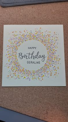 a happy birthday greeting card with confetti sprinkles in the center