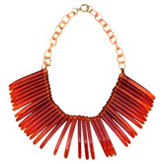 This very in vogue collar choker vintage resin necklace looks like fringe. It is tortoise like in color with resin links in a lighter amber color. It lays beautifully on the neck. A great piece for any wardrobe. Fringe is in, hot and back! It is from the 70's. Fun and conversational! Very chic! You can adjust the size where it sits on your neck with the links. This is very hip on one's neck. This will never go out of style. Perfect for any season and any time. Resin is hot! It will always remain Gold Collar Necklace, Chanel Pearls, Collar Choker, Fringe Necklace, Neck Jewellery, White Gold Necklaces, Designer Fashion Jewelry, Modern Necklaces, Resin Necklace