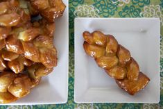 two white plates topped with pastries next to each other