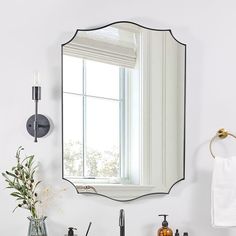 a bathroom sink with a mirror above it