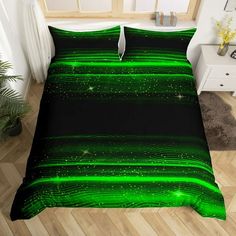 a bed with green lines and stars on it