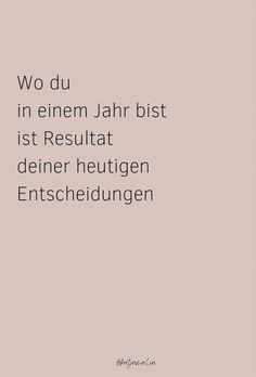 the words are written in german and english on a light pink background with black lettering