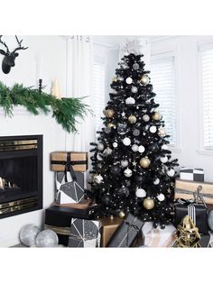 a black and white christmas tree in a living room