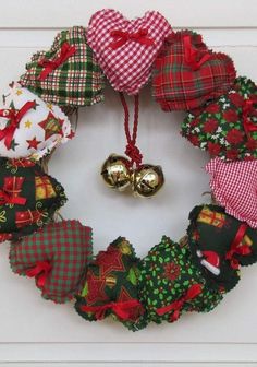 a christmas wreath made with fabric and bells