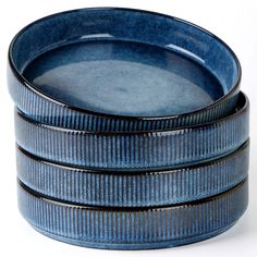 three blue dishes stacked on top of each other