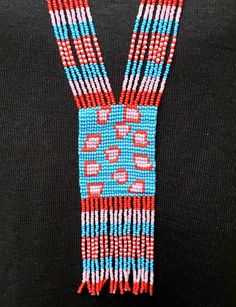 Cheetah pattern colorful long seed bead necklace with fun fringe. This necklace says summer, beach, resort. Necklace measures 16 inches, pendant measures 4 1/2 inches from top to the bottom of the fringe. No clasp, just slip over your head. Striking with a swingy beach dress or a jean jacket. Shop more necklaces here: https://www.etsy.com/shop/BoutiqueByMaryam?section_id=21694658 Be sure to visit the rest of my shop here: https://www.etsy.com/shop/boutiquebymaryam Multicolor Beaded Lariat Necklace With Round Beads, Long Beaded Festival Necklaces With Dangling Beads, Festival Long Beaded Necklaces With Dangling Beads, Long Beaded Necklaces With Dangling Beads For Festivals, Beaded Lariat Necklace For Festival, Southwestern Style Multicolor Necklace For Beach, Southwestern Multicolor Beaded Necklaces For Beach, Southwestern Style Multicolor Beaded Necklaces For Beach, Southwestern Style Multicolor Beaded Necklace For Beach