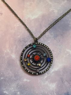 This gorgeous necklace is perfect for any powerful princess from beyond the stars. The large pendant is uniquely jeweled with an array of colorful crystals representing our gorgeous and vast endless solar system. Be the center of the universe in the attention demanding powerful and majestic beauty! Available in two unique and equally gorgeous styles! Solar System Jewelry, Space Necklace, Pinterest Wardrobe, Colorful Crystals, Space Stuff, Space Jewelry, Buffy Summers, Box Chain Necklace, Bronze Jewelry