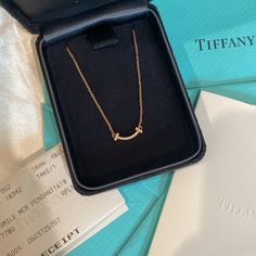 Tiffany&Co T Smile Pendant In 18k Rose Gold A Valentine’s Day Gift I Received Back In 2019 Personally Not A Big Fan Of This Style So I’ve Never Worn It It Has Been Sitting In The Case Forever Include Original Gift Receipt, Jewelry Box, Gift Bag, And And Empty Note Card. This Is The Full Set Of Original Packaging. I Just Don’t Have The White Ribbon That Tied Over The Tiffany Blue Gift Box Anymore. Sold For $1750 Usd Before Tax Now Following Description Is From Tiffany Website: Graphic Angles And Gold Tiffany Jewelry, Designer Pink Gold Jewelry Gift, Designer Pink Gold Jewelry As A Gift, Tiffany Diamond Necklace, Tiffany Smile Necklace, Diamond Necklace Tiffany, Rose Gold Diamond Necklace, Jewelry Box Gift, Tiffany Rose