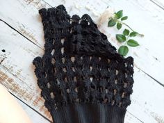 This black cotton crochet top might be a specimen of beyond the time fashion. Sleeveless openwork slouchy crocheted cloth is fitted nicely on the waist. Lacy pattern makes it a lovely second layer or cover up for an office shirt or casual blouse. Its all-match minimalist look will contribute your vintage, harajuku or mid-century outfit. The photos represent S size item. You may order this top in sizes S, M, L, XL and in the variety of colours (please, see the final photo) Material: You may choose between the mercerized cotton and microfiber yarn. This item is made to order and here are the approximate measurements for the standard sizes: Small Bust: 30-32"/76-81.5cm   Waist: 25-26"/63.5-66cm Medium Bust: 32-34"/81.5-86.5cm   Waist:27-28"/68.5-71cm Large Bust: 36-38"/91.5-96.5cm    Waist: 3 Stretch Crochet Top With Hollow Out Design For Summer, Spring Black Open Knit Crochet Top, Black Stretch Crochet Top For Summer, Black Crochet Top With Crochet Trim For Spring, Spring Black Crochet Top With Crochet Trim, Black Crochet Lace Top For Summer, Black Crochet Lace Dress For Summer, Black Sleeveless Crochet Top For Spring, Black Sleeveless Open Knit Crochet Top